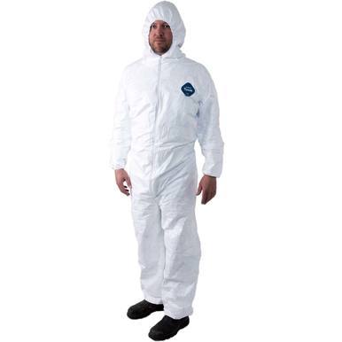 A person wearing a Dupont Tyvek 400 TY127S Coverall Suit with a hood and black shoes stands against a plain background. The disposable work suit, which comes in a case of 25, features a small blue label on the chest, indicating its suitability for applications such as toxic material abatement.