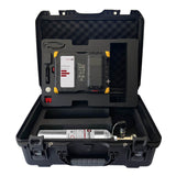 A black hard case opens to reveal the WatchGas SST Dock Bundle, featuring a calibration gas canister, control device, and organized equipment in compartments with black foam padding.