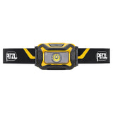 The Petzl ARIA 1 Headlamp E069AB00 is a black and yellow headlamp with a central LED, adjustable strap, and the Petzl logo on both sides of the band for reliable hands-free lighting.