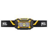 The Petzl ARIA 1R Rechargeable Headlamp E069CB00 features an adjustable strap, central LED, and Petzl logos. Its black and yellow design offers reliable job site lighting in a compact, rechargeable package.
