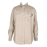 The ForgeFR Ladies Solid Snap Shirt LFRSLD is a beige long-sleeve FR shirt designed with two chest pockets featuring button closures. It is crafted with durable aramid sewing thread for increased safety and compliant with NFPA 2112 standards. The shirt also includes additional front buttons and a subtle red logo on the right pocket.