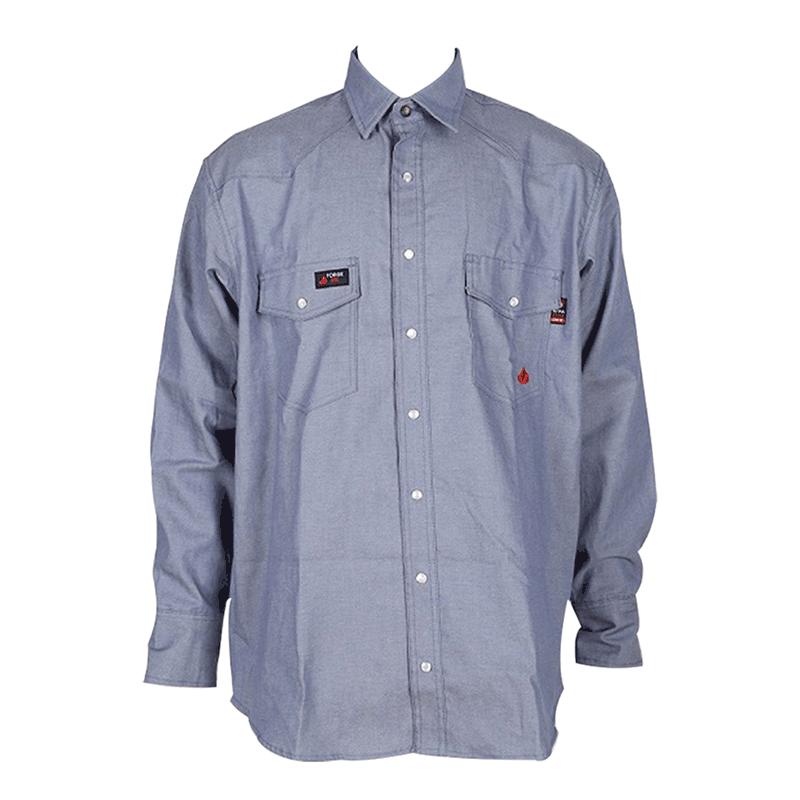 The ForgeFR Chambray Shirt (MFRCLS0010) is a flame-resistant blue long-sleeve button-up workwear shirt featuring two chest pockets and subtle brand patches.