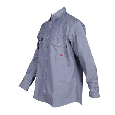 Introducing the ForgeFR Chambray Shirt MFRCLS0010: a blue long-sleeve industrial flame-resistant work shirt equipped with buttoned chest pockets. This durable shirt boasts a folded collar and buttoned cuffs, beautifully showcased on a mannequin torso. Ideal for individuals in need of reliable flame-resistant apparel.