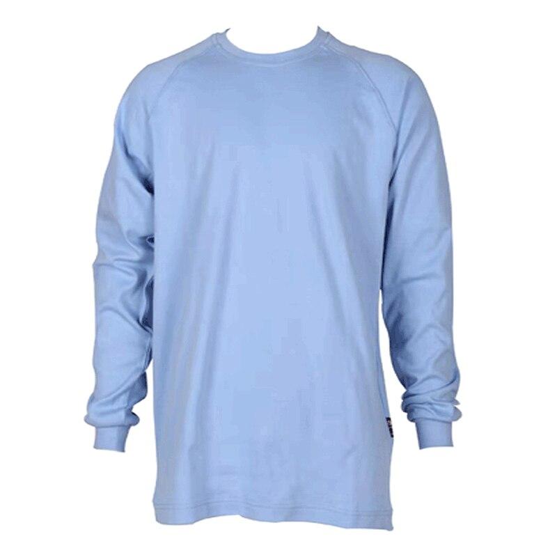 The ForgeFR Crew Neck Tee MFRCNT-009 is displayed on a plain white background in a light blue color, featuring long sleeves that are slightly wrinkled for a relaxed fit. This shirt, with its basic design and round neck, offers safety features with an arc rating of ATPV 11 cal/cm² and UL classified NFPA 2112 for additional protection.