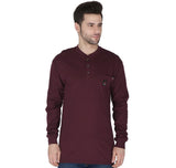 A man in the ForgeFR Henley MFRHNLY-004, a maroon shirt meeting NFPA 2112 standards with an arc rating ATPV of 11 cal/cm², stands against a white background. This long-sleeve shirt has a buttoned placket and features a small chest pocket. He has short dark hair and is looking to the side.