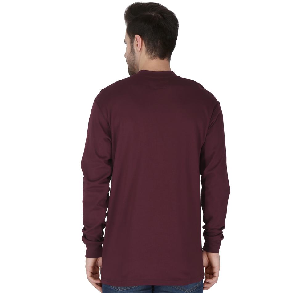 A person wearing the ForgeFR long-sleeve maroon Henley shirt (MFRHNLY-004), which meets NFPA 2112 standards, stands with their back to the camera to highlight its design. They have dark hair and are paired with blue jeans against a plain white backdrop.