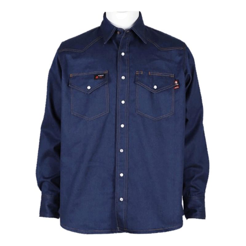 The ForgeFR Solid Shirt Denim MFRSLD-002 is a dark blue denim workwear shirt featuring long sleeves and white buttons. It includes pointed collars, two chest pockets with button closures, and brown stitching, making it an ideal choice for those in search of stylish flame-resistant clothing.