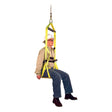 A person wearing a safety helmet and glasses sits comfortably in the French Creek Bosun Chair Work Seat 4154, which is attached to a rope. Sporting a beige shirt, blue jeans, and brown boots, they seem to be demonstrating fall protection equipment from French Creek Production that is perfect for tasks such as window washing.