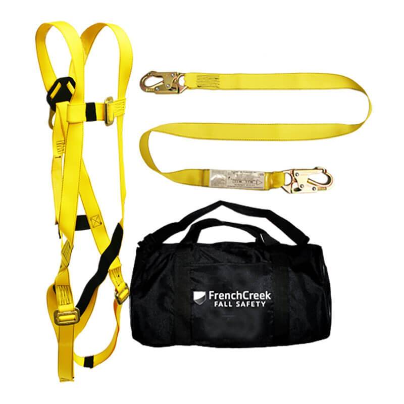 The French Creek 601 Series Full Body Harness/Lanyard Kit 631-KIT features yellow straps, a shock absorbing lanyard with two hooks, and includes a carrying bag labeled "French Creek Fall Safety." Designed by French Creek Production, this full body harness meets OSHA requirements to ensure maximum protection and comfort.