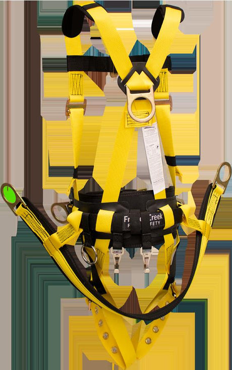 The French Creek Production Tower Climbing Harness with Hip D-Rings 850ABT comes in bright yellow, featuring adjustable straps, metal rings, and a black waist belt. It's perfect for fall protection and is seen hanging vertically against a plain background, complete with its label.