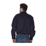 A man stands with his back to the camera, wearing a ForgeFR Forge FR Solid Button Shirt MFRLB2PS024 in dark navy and blue jeans against a plain white background.
