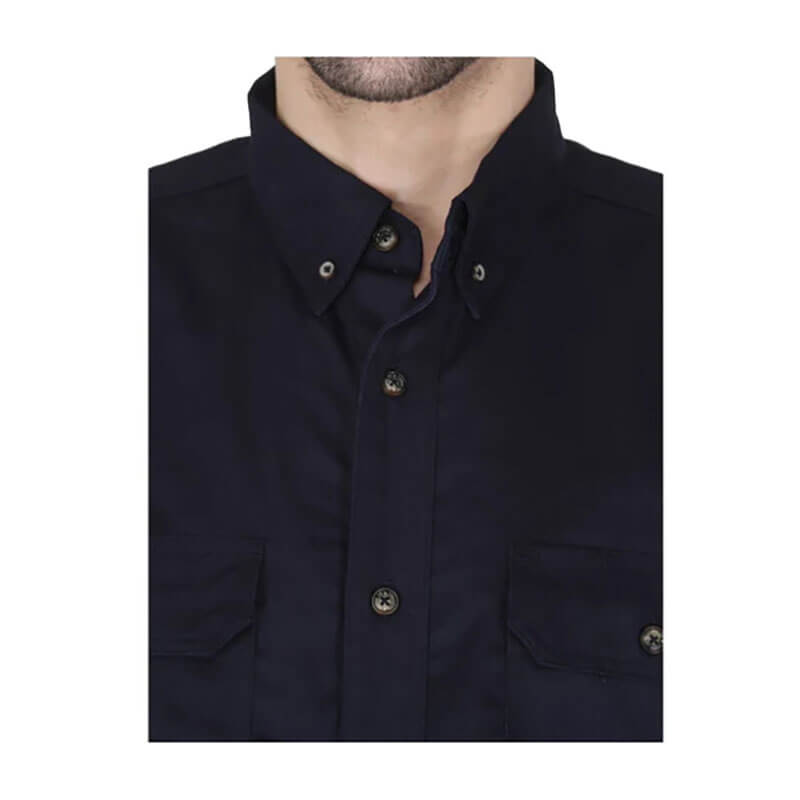 Close-up of a person wearing the ForgeFR Forge FR Solid Button Shirt MFRLB2PS024, a dark navy blue NFPA 2112 flame resistant shirt with a collar and two front pockets. Image shows only the lower face, neck, and upper torso.