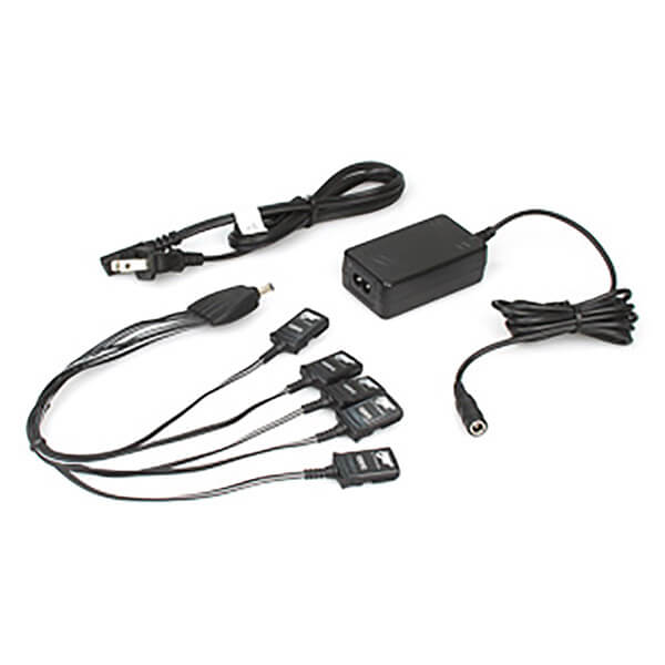 The BW GasAlert 5 Unit Charging Assembly GA-PA-1-MC5-NA by BW Technologies includes a black adapter, power cord with plug, and cable splitter with four connectors. Components are organized on a white background for easy identification and are ideal for use with BW GasAlert devices.