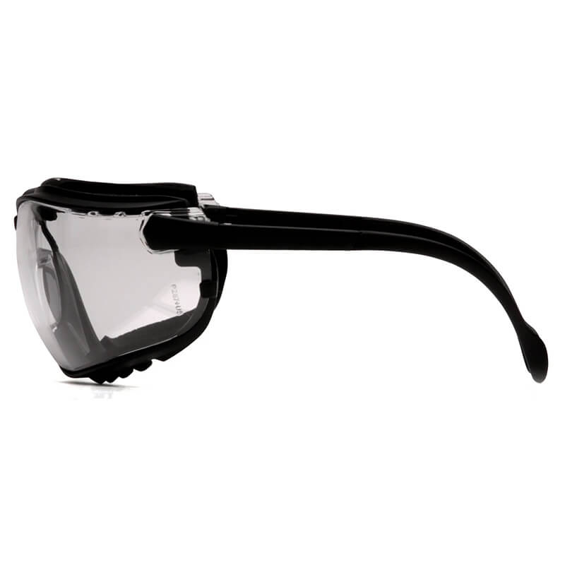 Side view of Pyramex V2G Goggles GB18_0ST by Pyramex Safety—black safety goggles with clear anti-fog lenses and thick, curved arms for enhanced eye protection. Ships in boxes of 12.
