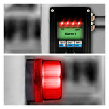 The GfG EC28 CO Fixed Transmitter 2811-707-00 utilizes advanced smart sensor technology to activate an alarm with bright red lights and a digital display showing "Alarm 1," complemented by test and info buttons. Additionally, an ATEX-certified red warning light is triggered below.