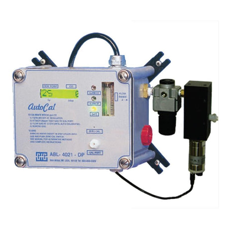 The "GfG Respiratory Air Monitoring 4021 AutoCal System" is a product by GfG featuring a control panel, digital display, and an attached pneumatic valve. Mounted on a metal bracket, this system is designed for calibration or monitoring purposes and can include dew point measurement capabilities.