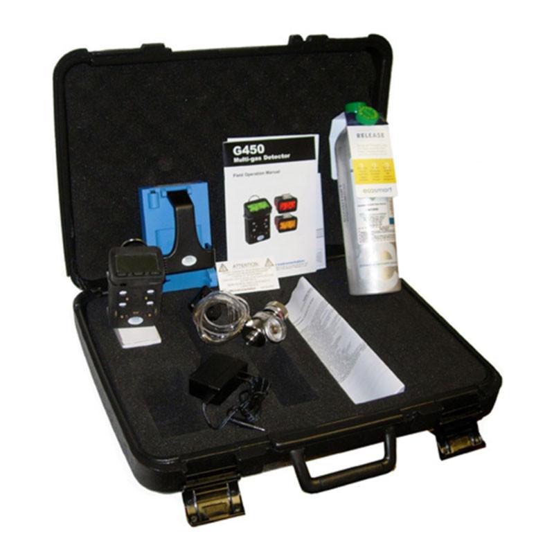 A black carrying case contains the GfG Microtector II G450 4 Gas Detector (model G450-11410), featuring auto-calibration and LEL capabilities. Inside, you'll find a manual for the G450 multigas detector, a gas canister, charging accessories, and various components neatly arranged.