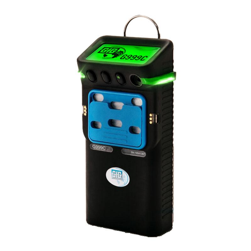 A black and green GfG Polytector III G999C gas detector with a digital display and multiple sensors on the front. The screen displays "G999C," with the GfG logo visible below the sensors. This compact device also features wireless monitoring, ensuring efficient detection of O2, LEL, CO, and H2S gases seamlessly.