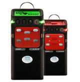 Two black GfG Polytector III G999P O2, CO/H2S, IR LEL Gas Detectors with red buttons and digital displays offer real-time monitoring. One of these sleek devices presents data on a green screen, while the other shows it on a red screen. Both feature antennas and stylish red accents.