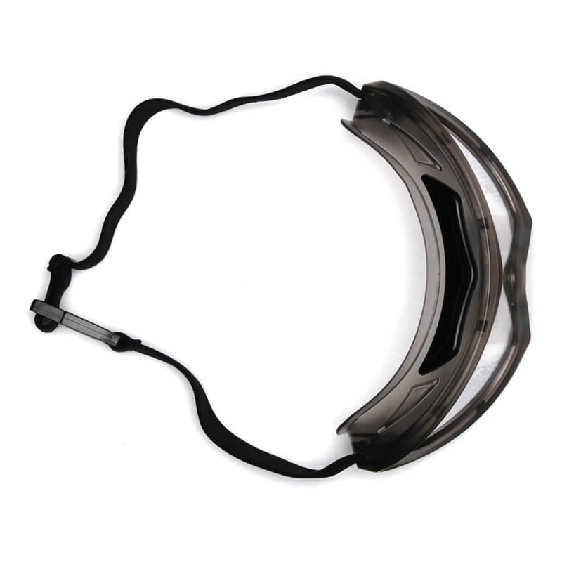 The Pyramex Capstone Anti-Fog Safety Goggles GG504T by Pyramex Safety provide impact protection and pair well with a transparent plastic face shield with an adjustable black strap for enhanced personal protective coverage.