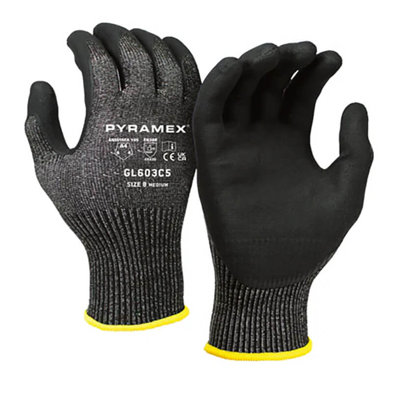 A pair of Pyramex CorXcel Micro-Foam Nitrile Gloves GL603C5 in black, featuring a gray knitted texture and rubber-coated palms for enhanced grip. These cut-resistant gloves are engineered for additional protection with their micro-foam nitrile design. Brand and specifications are clearly marked with symbols and text on the back of each glove.