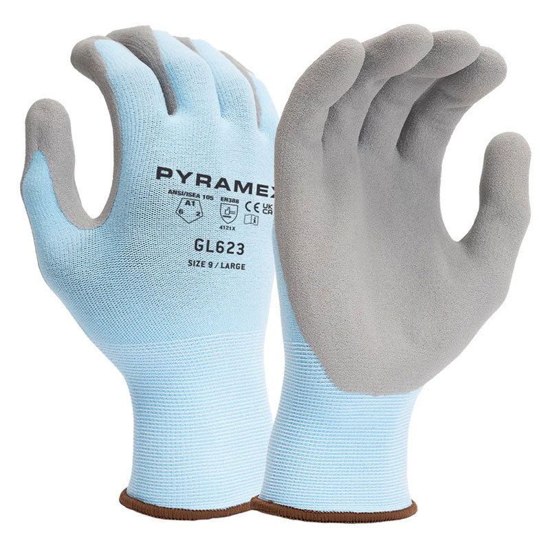 The light blue Pyramex Micro-Foam Nitrile Gloves GL623, featuring gray palms and fingertips, provide exceptional grip and abrasion resistance. One of the gloves is positioned upright while the other is facing forward, showcasing the label "PYRAMEX GL623" along with safety icons and size details.