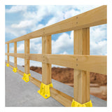 A Frontline Fall Protection Safety Guardrail with yellow GPB200 Boot Base supports is installed along a sloped concrete edge, set against a backdrop of blue sky and clouds.
