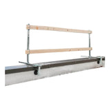 The French Creek Portable Guardrail System GR200 from French Creek Production combines metal and wooden elements, mounted on a steel beam. This system includes two parallel wooden bars secured to metal posts for effective fall prevention and safety along the beam. Perfect for various parapet installations, it offers an ideal mix of durability and practicality.