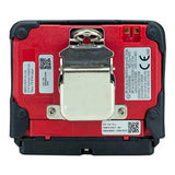 The image shows the back of the RKI Instruments GX-3R Pro 5 Gas Confined Space Monitor with Wireless Communication, featuring a red panel, central metal clip, QR codes, technical labels, and two gold contacts at the upper right.