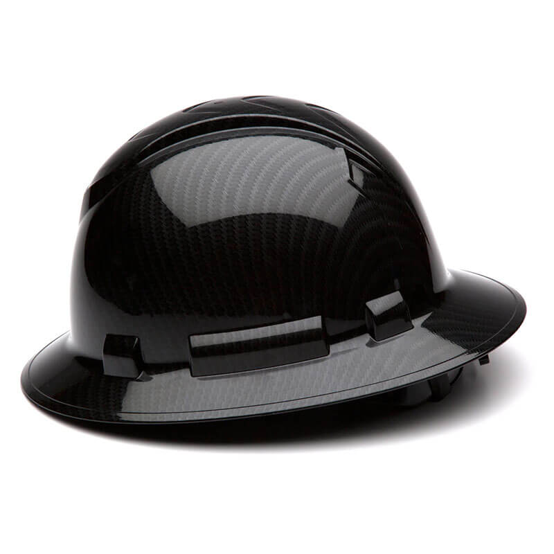 A Pyramex Safety Hydro Dipped Ridgeline Full Brim Hard Hat (12/Case) with a glossy carbon fiber finish is displayed on a white background, featuring ventilation ridges, a wide brim, and meeting ANSI Z89.1-2014 standards.