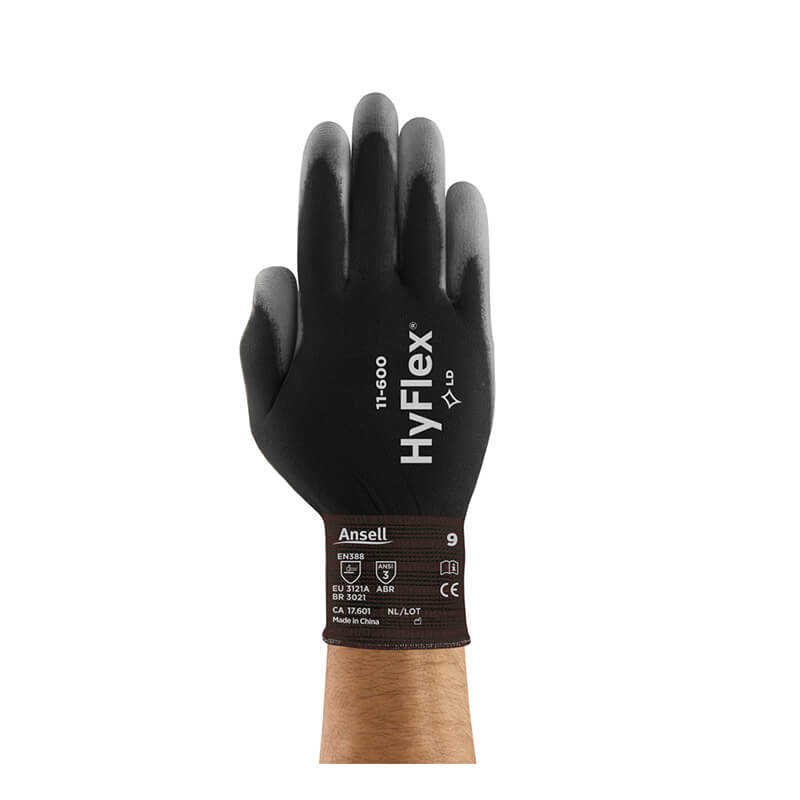 A hand wearing a black Ansell HyFlex Polyurethane Coated Glove 11-600, featuring a comfortable nylon knit liner for enhanced dexterity, is shown with the palm facing forward against a white background.