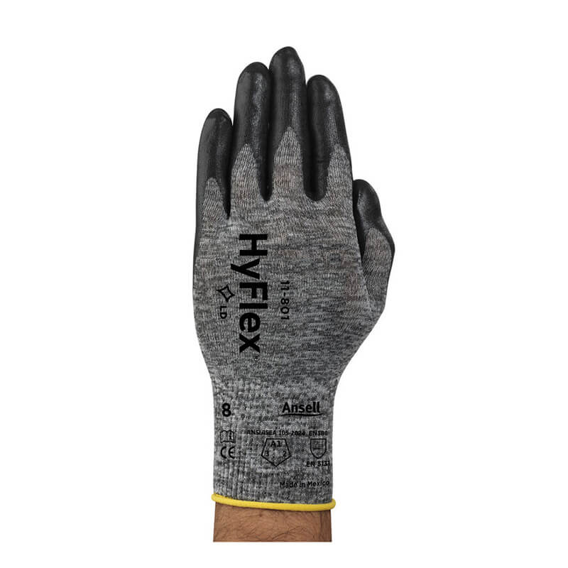 A hand wearing an Ansell HyFlex Nitrile Foam Glove 11-801, featuring a gray and black design with foam nitrile coating and Knitted Variable Stitch Design for enhanced comfort, is shown palm-down against a white background.