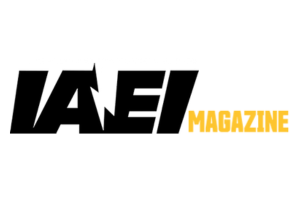 Logo of IAEI Magazine featuring bold, black letters "IAEI" with an electrical bolt incorporated into the "A," and the word "MAGAZINE" in yellow to the right. The design is set against a white background.