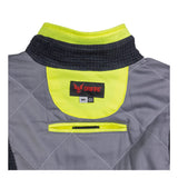 NSA DRIFIRE FR Hi-Vis Insulated Jacket JKT-01C3-HV features a gray and black flame-resistant design with a neon yellow inner collar, quilted stitching, and a DRIFIRE brand tag. On the back, a horizontal velcro strap is positioned below the tag. This jacket meets ANSI/ISEA 107 standards for enhanced safety.