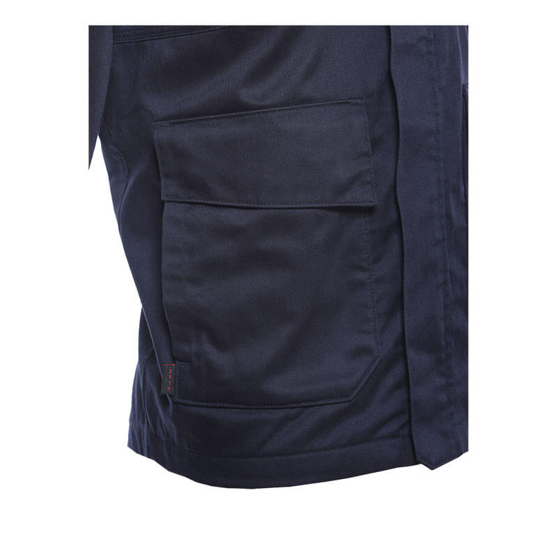 Close-up of the NSA DRIFIRE FR Insulated Jacket JKT-01UD in navy, showing its sturdy flame-resistant fabric and large rectangular flap pockets.