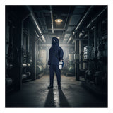 An individual in NSA’s Enespro HRC4 Kit Arc 40 Indura Ultra Soft (With Gloves) stands at the center of a dimly lit industrial facility surrounded by pipes and machinery.