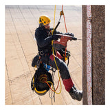 A worker in safety gear and a yellow helmet uses a power drill while suspended by ropes with the Petzl ASAP'SORBER AXESS L071CC00 energy absorber, demonstrating rope access on a numbered vertical structure.