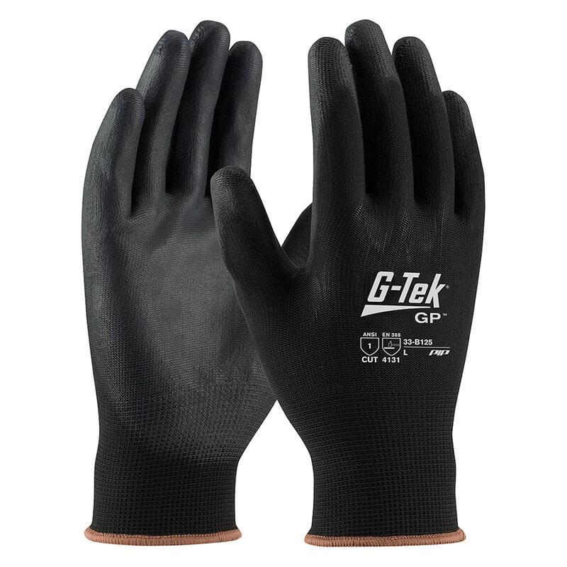 A pair of PIP G-Tek Knit Nylon Blend Gloves with PU Coated Flat Grip (33-B125) in black, featuring ANSI and EN388 cut resistance ratings indicated by text and symbols. These nylon gloves have a seamless knit design and polyurethane coating, offering both safety and a tactile grip.