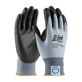 The PIP G-Tek 3GX ECO Dyneema Diamond 2.0 gloves, available in a set of 12 pairs, feature black palms and fingers with a gray back and cuffs. These PU Flat Grip gloves utilize advanced Dyneema Diamond technology to provide excellent hand protection, complete with a printed label indicating their cut resistance specifications.