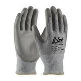 A pair of PIP G-Tek PolyKor Industry Grade work gloves featuring a polyurethane-coated flat grip for enhanced traction and protection. These gray gloves provide excellent cut resistance and are clearly labeled with safety and product information on the back.