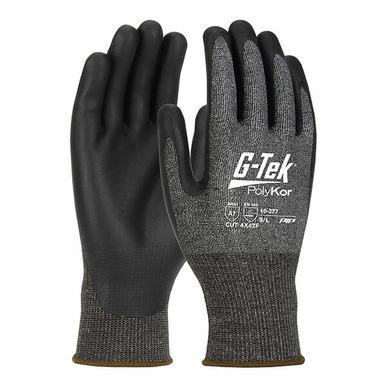 The PIP G-Tek PolyKor X7 16-377 gloves feature a stylish black and gray design, with "G-Tek PolyKor" displayed on the back of one glove. The hand area boasts a textured material, enhanced by solid black on the fingers and palm, providing durability and touchscreen compatibility.