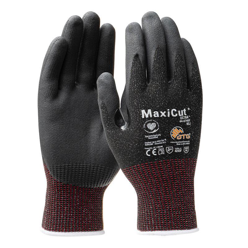 A pair of PIP MaxiCut Ultra Nitrile MicroFoam A6 Gloves (model 44-6745F) boasts black palms and fingertips with dark red wrist cuffs. Featuring a Nitrile MicroFoam Grip, these gloves are touchscreen compatible and have text and safety icons printed on the back.