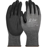 The PIP G-Tek PolyKor Glove w/Nitrile Coated Foam Grip 16-328, offered by Protective Industrial Products (PIP), boasts seamless knit construction with black nitrile-coated palms and gray backs featuring textured patterns. These gloves provide a snug fit with elastic cuffs and are touchscreen compatible, making them convenient to use while ensuring your hands stay protected on the job.