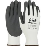 A pair of white and gray PIP G-Tek ECO Yarn/Spandex MicroSurface Grip Gloves, made with eco-friendly recycled yarn and featuring gray rubber palms. The nitrile-coated grip provides excellent handling. Displaying safety symbols, the model number 31-530R, and size 9/L, these gloves offer both durability and sustainability from PIP - Protective Industrial Products.