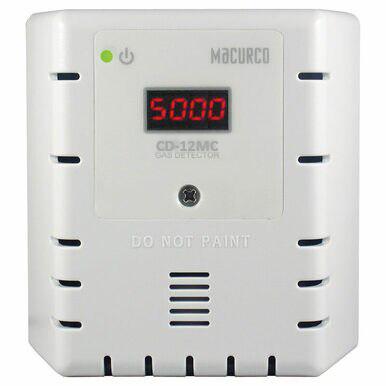 The Macurco CO2 Fixed Gas Detector Controller Transducer boasts a digital display showing "5000" ppm. It is designed for commercial refrigeration environments and features a power button, a green indicator light, and displays a "DO NOT PAINT" warning on its panel.