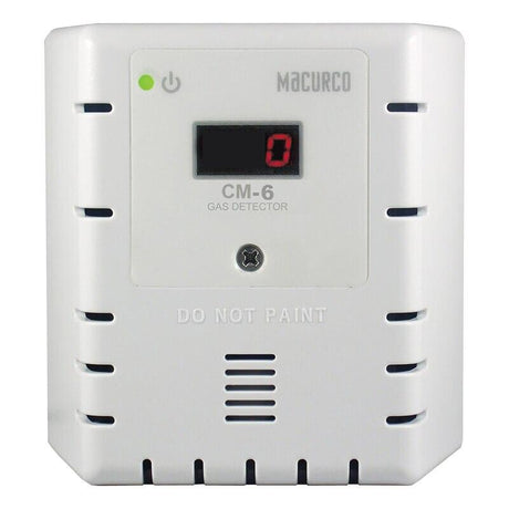 A white Macurco CO Fixed Gas Detector Controller Transducer, designed for commercial facilities, features a digital display showing "0". Equipped with ventilation slits and indicator lights, the device prominently displays the text "DO NOT PAINT" on the front for optimal carbon monoxide detection.