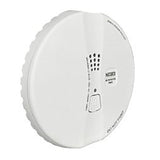 A sleek, low-voltage Macurco Residential Round Mount CO Gas Detector CM-E1-R_ in white is mounted on the wall, showcasing a round shape with vents and a test button at its center.