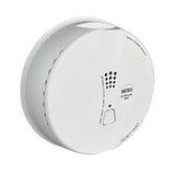 The Macurco Residential Round Mount CO Gas Detector CM-E1-R_, by Macurco, is a round, white carbon monoxide monitor with a small vent and a test button on its surface, seamlessly mounted on the ceiling.