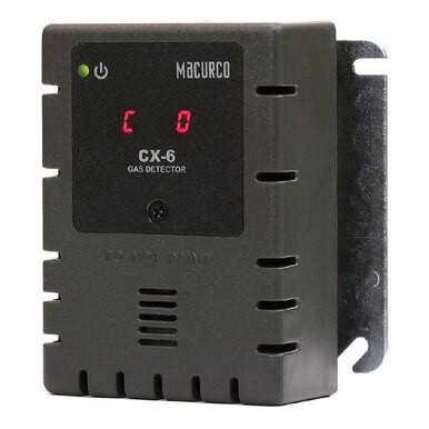 The black Macurco Dual CO/NO2 Fixed Gas Detector Controller Transducer is a versatile device featuring a digital display and ventilation slots, all mounted on a sturdy metal bracket.