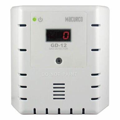 A white Macurco LEL Fixed Gas Detector Controller Transducer, labeled with "GD-12" and featuring a digital display reading zero, serves as an essential piece of safety equipment. It includes ventilation slits on the sides and bears the warning "DO NOT PAINT" below the display to highlight its role in combustible gas detection.